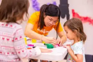 UT student volunteering with children